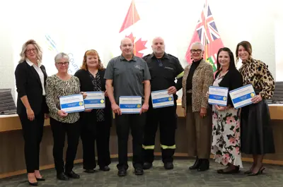 CAO Sandra Zwiers and Warden Hilda MacDonald with those recognized for teamwork at the 2024 Employee Excellence Awards.